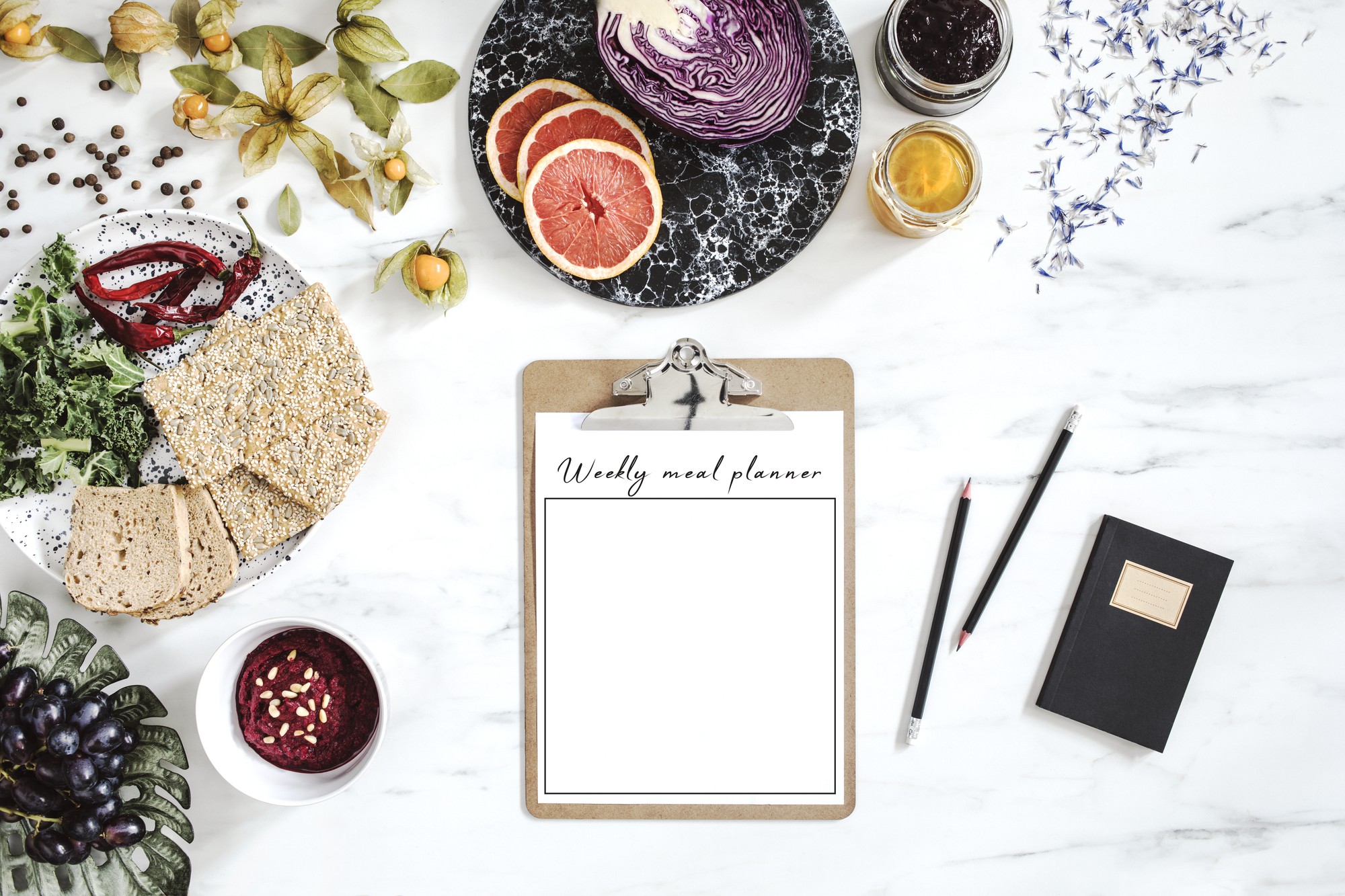 flat lay of recipe notes, invoices and sample plates